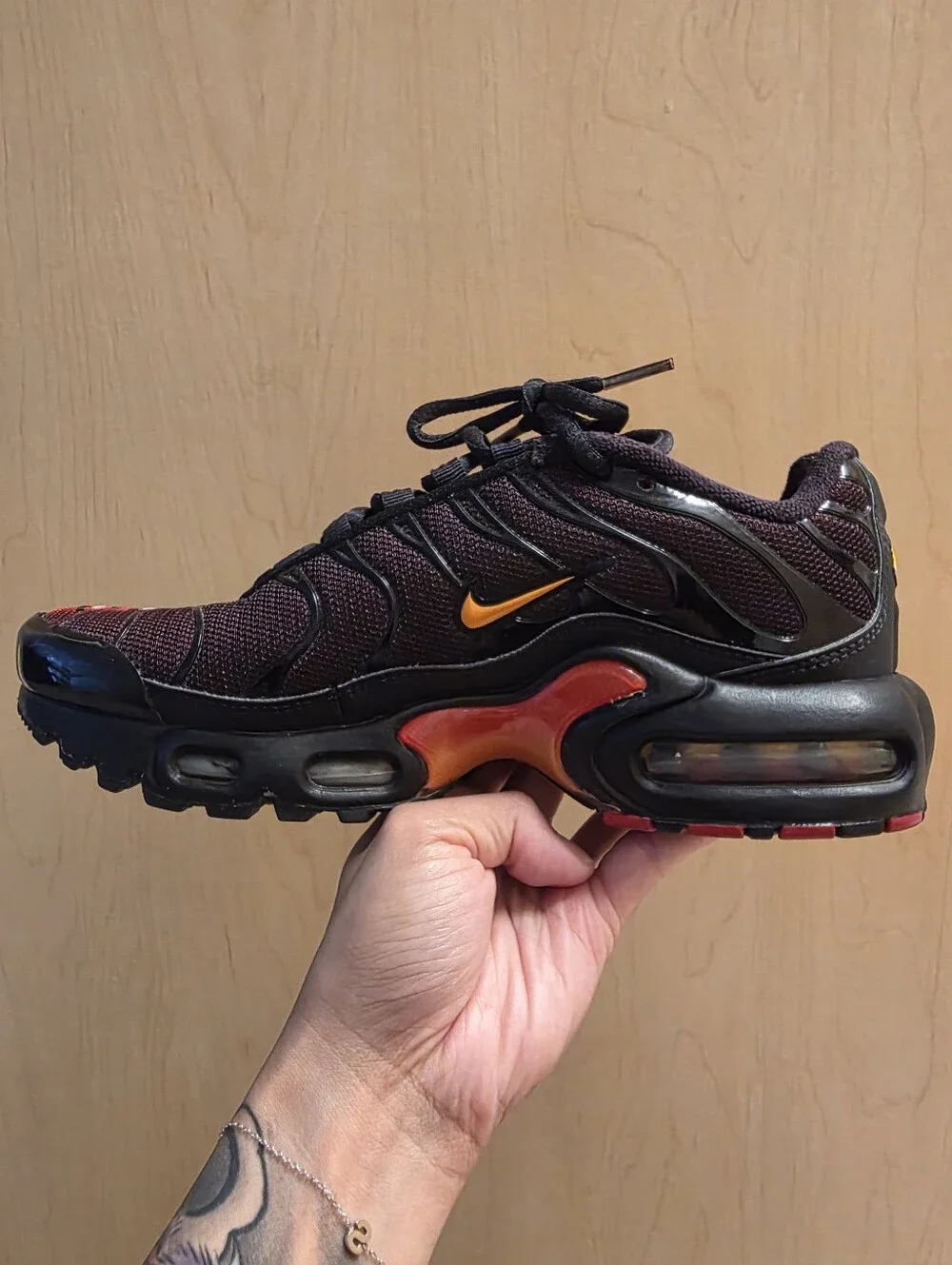 Nike Air Max Plus Black with Red and Yellow Accents